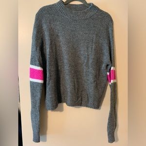 Grey sweater with pink striping on sleeves